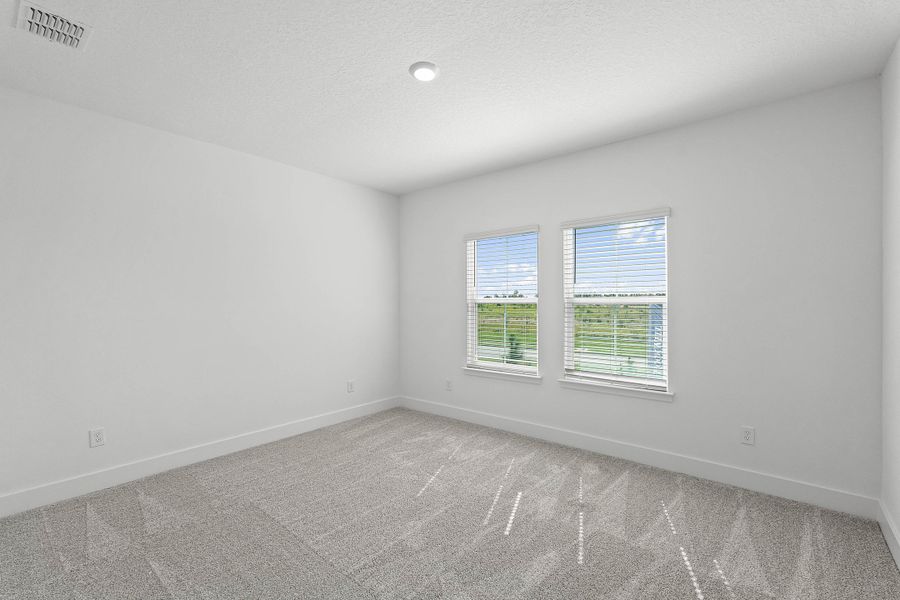 Spacious, unfurnished interior of a new home in Harvest at Ovation - Townhomes, Winter Garden (Image 21).