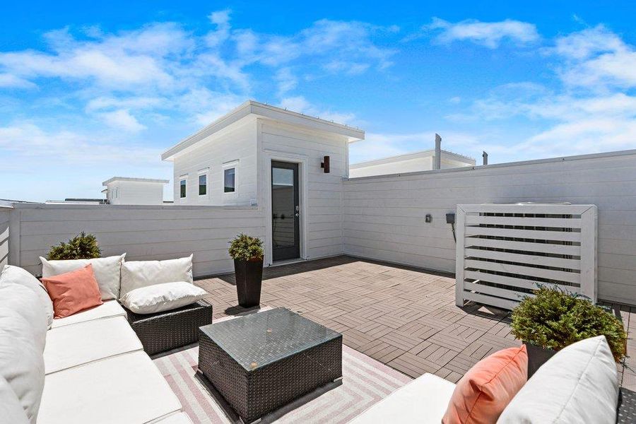 An inviting rooftop deck offers serene outdoor living with ample space for relaxation. An inviting rooftop deck offers serene outdoor living with ample space for relaxation.