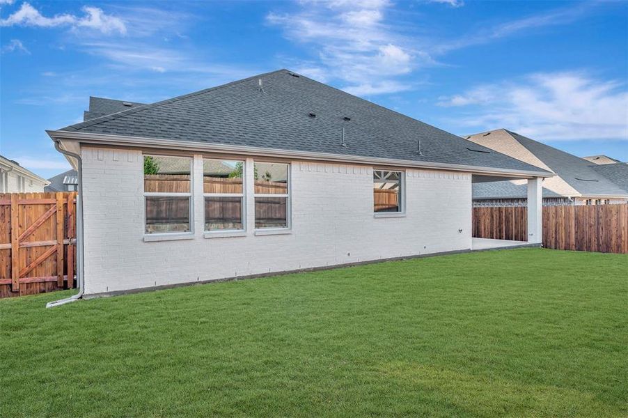 Exterior details and patio area of a home in Elevon, Lavon (Image 3).