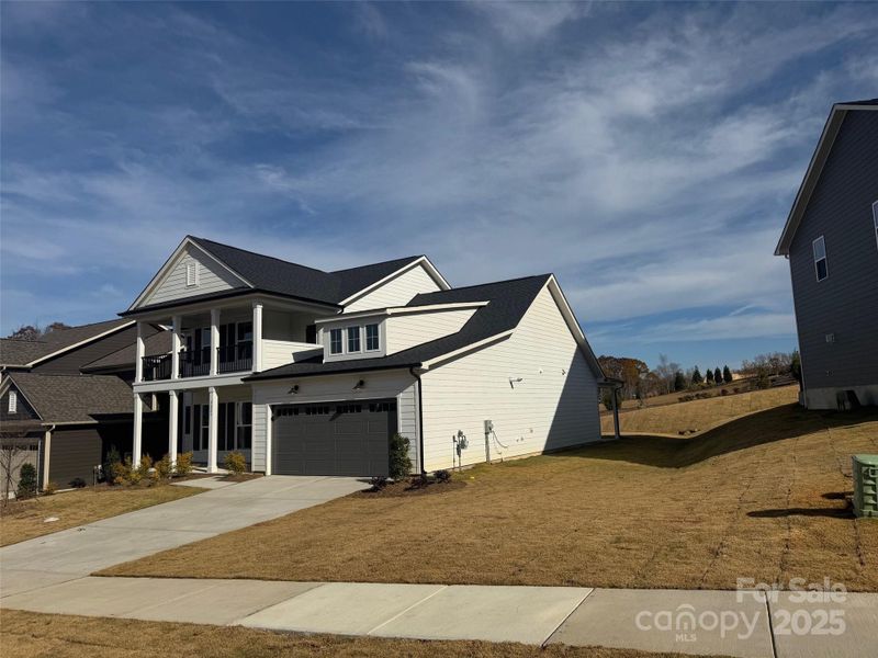 Front exterior of a new home in Forest Creek, Waxhaw, NC, highlighting curb appeal (Image 3).
