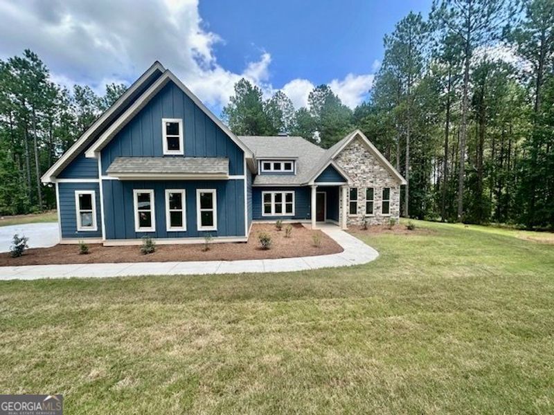 Front exterior of a new home in Dove Creek, LaGrange, GA, highlighting curb appeal (Image 1).