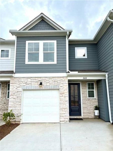 Front exterior of a new home in Stegall Village, Cartersville, GA, highlighting curb appeal (Image 61). Front exterior of a new home in Stegall Village, Cartersville, GA, highlighting curb appeal (Image 61).
