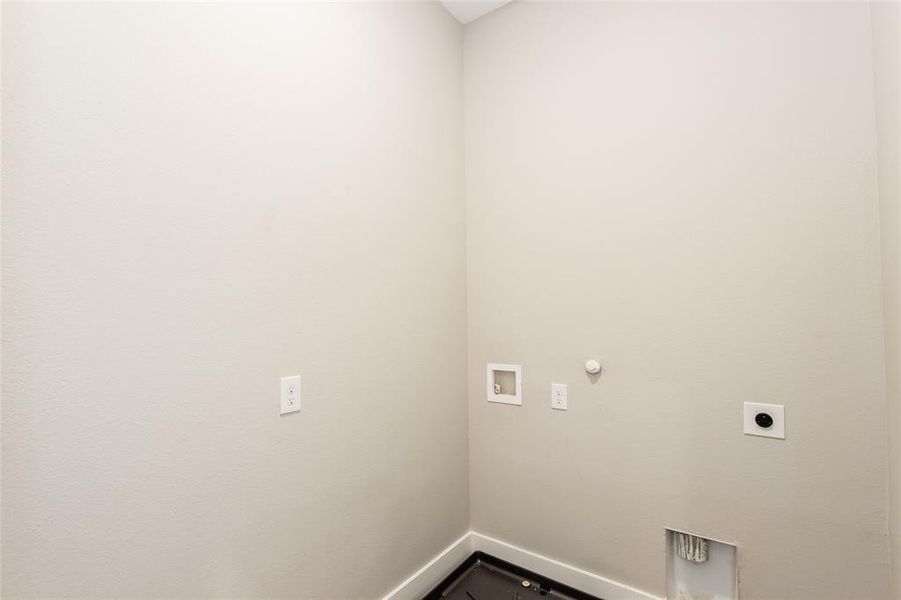 Laundry area featuring hookup for a gas dryer, washer hookup, and hookup for an electric dryer