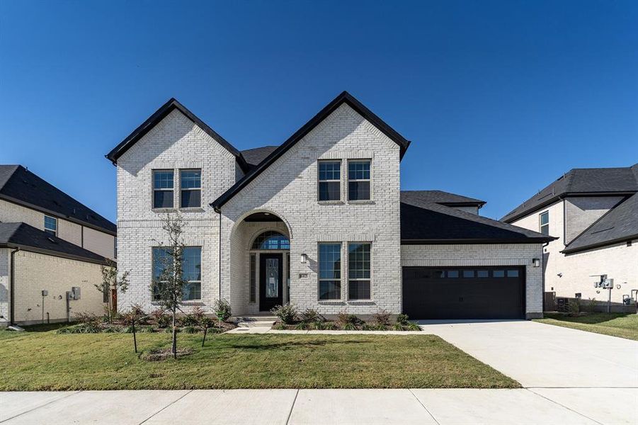 Front exterior of a new home in Green Meadows, Celina, TX, highlighting curb appeal (Image 2). Front exterior of a new home in Green Meadows, Celina, TX, highlighting curb appeal (Image 2).