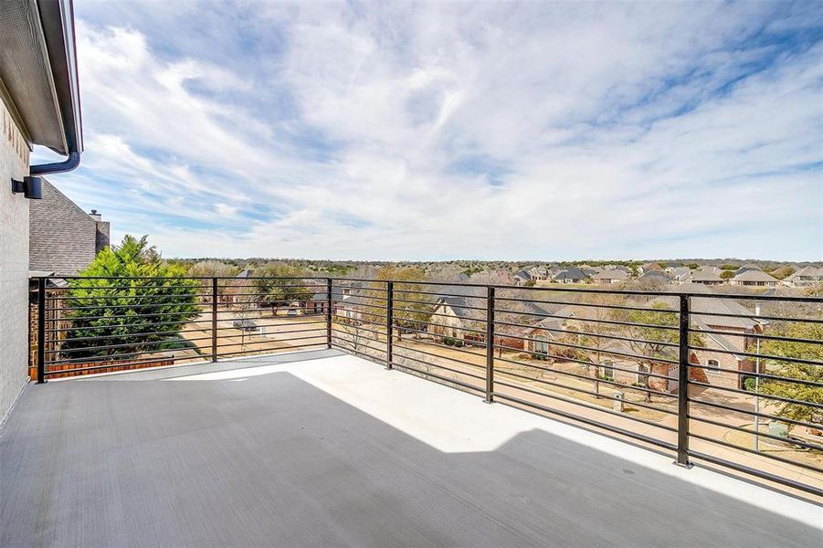 View of patio featuring a balcony