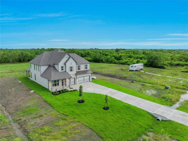 Front exterior of a new home in , Rosharon, TX, highlighting curb appeal (Image 29). Front exterior of a new home in , Rosharon, TX, highlighting curb appeal (Image 29).