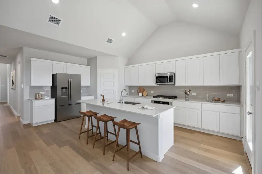 Kitchen in the Wimbledon home plan by Trophy Signature Homes – REPRESENTATIVE PHOTO Kitchen in the Wimbledon home plan by Trophy Signature Homes – REPRESENTATIVE PHOTO
