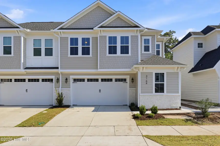 Front exterior of a new home in East & Mason, Wilmington, NC, highlighting curb appeal (Image 1). Front exterior of a new home in East & Mason, Wilmington, NC, highlighting curb appeal (Image 1).