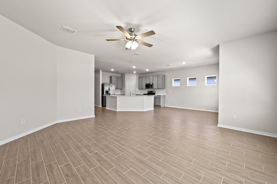 Unfurnished living room with recessed lighting and ceiling fan