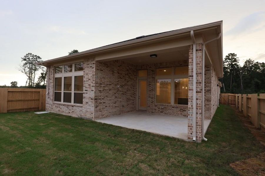 Exterior details and patio area of a home in ARTAVIA 45' Homesites, Conroe (Image 3). Exterior details and patio area of a home in ARTAVIA 45' Homesites, Conroe (Image 3).