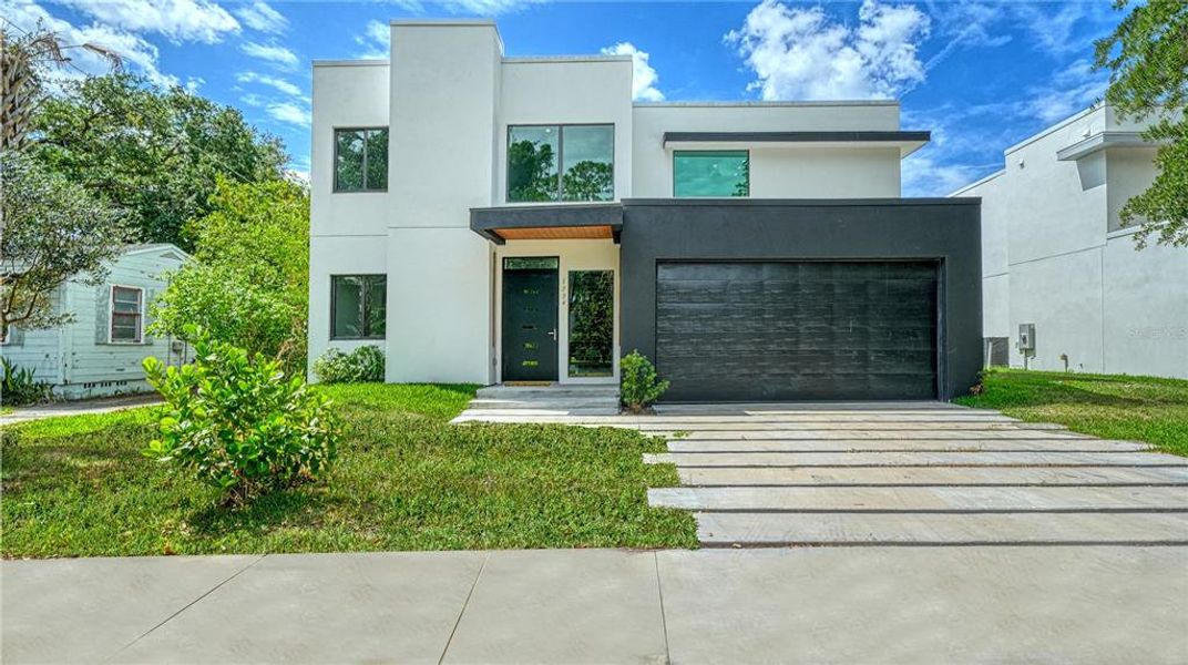 Front exterior of a new home in , Sarasota, FL, highlighting curb appeal (Image 1). Front exterior of a new home in , Sarasota, FL, highlighting curb appeal (Image 1).