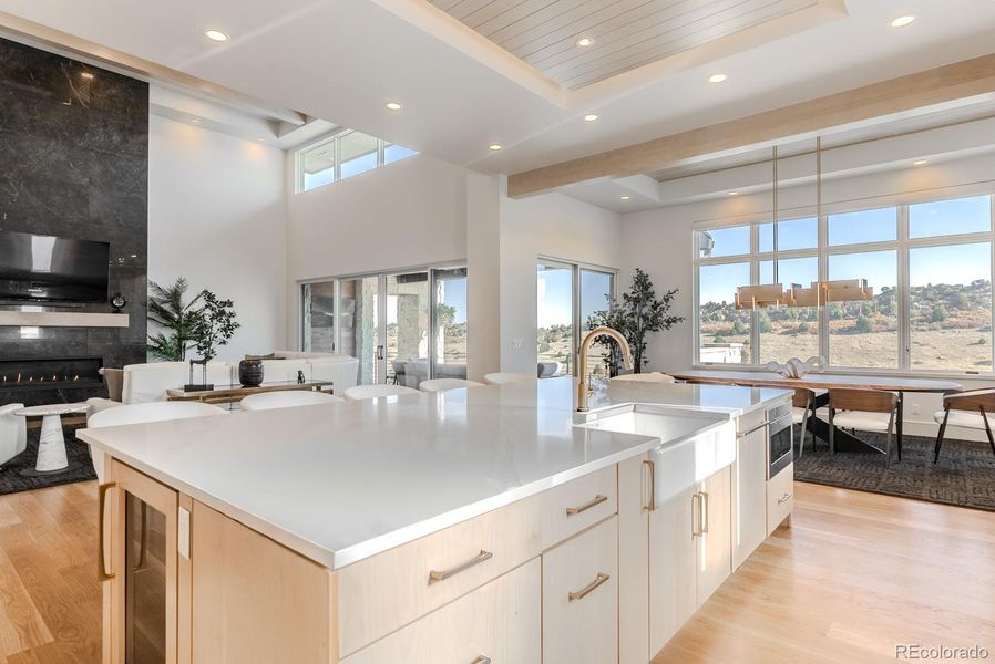 The continuity of flooring and ceiling lines ensures visual flow from the great room out onto the terrace with effortless grace.