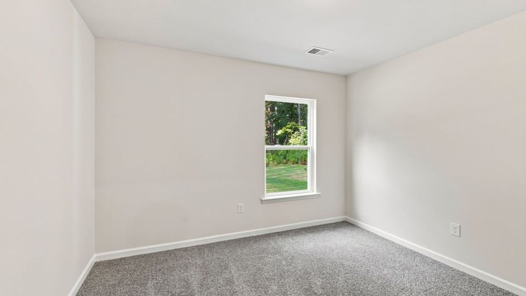 Spacious, unfurnished interior of a new home in Bentley Park, Greenwood (Image 22).
