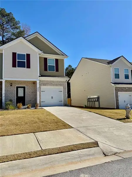 Front exterior of a new home in , Jonesboro, GA, highlighting curb appeal (Image 1).