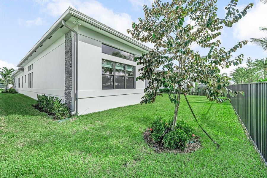 Front exterior of a new home in Apex at Avenir, Palm Beach Gardens, FL, highlighting curb appeal (Image 20). Front exterior of a new home in Apex at Avenir, Palm Beach Gardens, FL, highlighting curb appeal (Image 20).