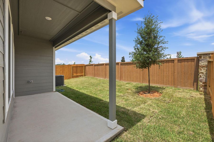 Exterior details and patio area of a home in Magnolia Woods, Magnolia (Image 2). Exterior details and patio area of a home in Magnolia Woods, Magnolia (Image 2).
