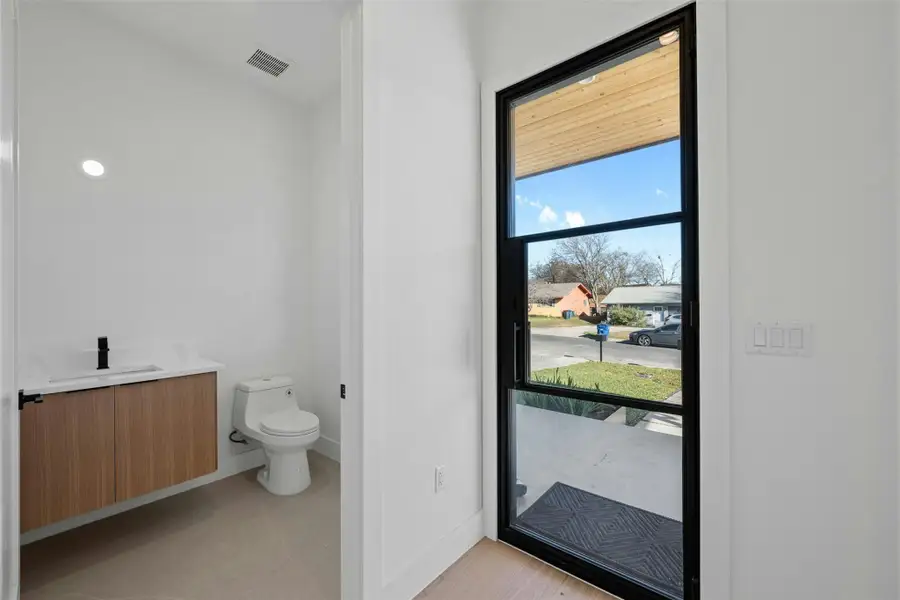 Bathroom featuring vanity and toilet Bathroom featuring vanity and toilet