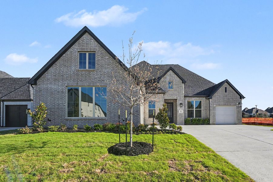 Front exterior of a new home in Quail Hollow, Rockwall, TX, highlighting curb appeal (Image 26). Front exterior of a new home in Quail Hollow, Rockwall, TX, highlighting curb appeal (Image 26).