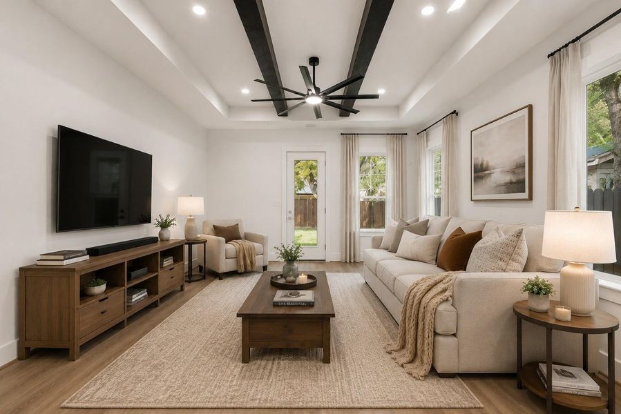 Spacious great room filled with natural light, featuring 11-foot ceilings with gorgeous exposed beams and easy access to the covered back porch. (Virtually staged) Spacious great room filled with natural light, featuring 11-foot ceilings with gorgeous exposed beams and easy access to the covered back porch. (Virtually staged)