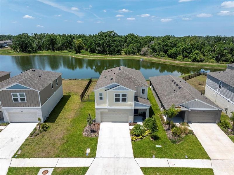 Front exterior of a new home in Crosswind Point, Parrish, FL, highlighting curb appeal (Image 2).