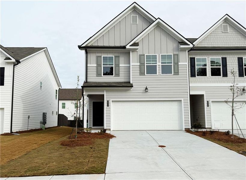 Front exterior of a new home in Rivershire Place, Villa Rica, GA, highlighting curb appeal (Image 2).