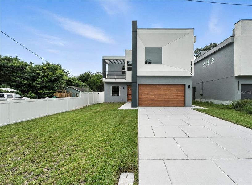 Front exterior of a new home in , Orlando, FL, highlighting curb appeal (Image 2). Front exterior of a new home in , Orlando, FL, highlighting curb appeal (Image 2).