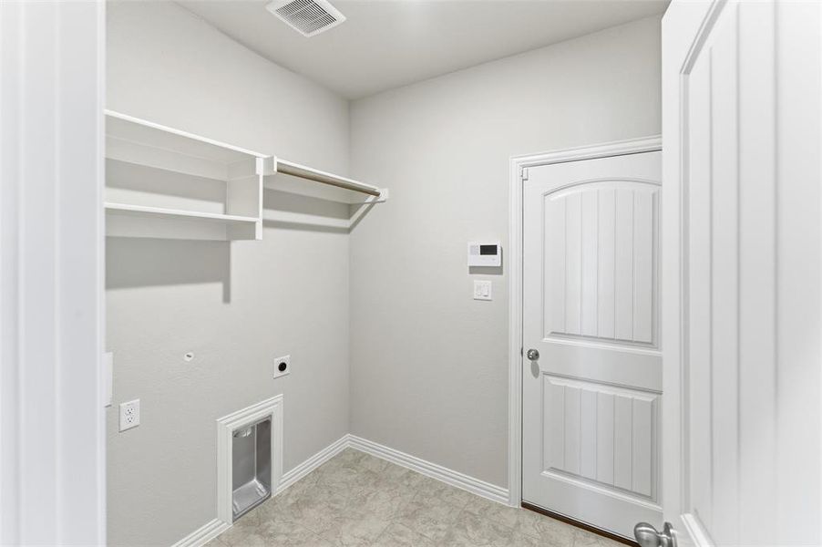 Laundry area with electric dryer hookup and gas dryer hookup