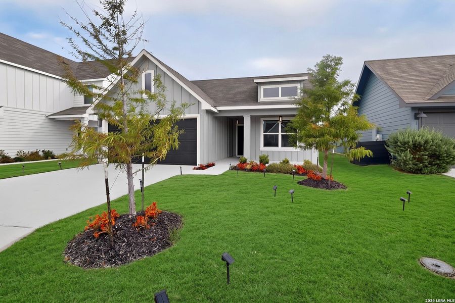 Front exterior of a new home in Saengerhalle Meadows, New Braunfels, TX, highlighting curb appeal (Image 22).