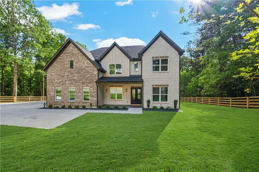 Front exterior of a new home in , Dacula, GA, highlighting curb appeal (Image 27).