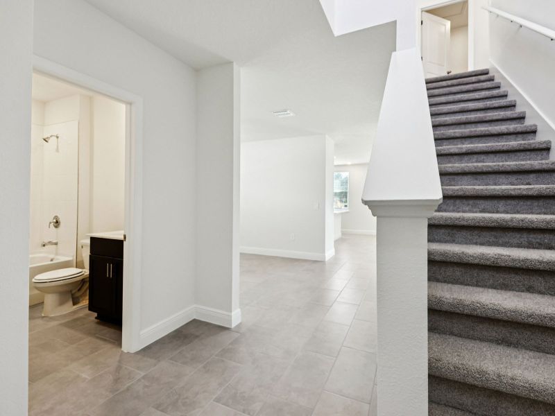 Spacious, unfurnished interior of a new home in The Reserve at Hammock Oaks - Signature Series, Lady Lake (Image 10).