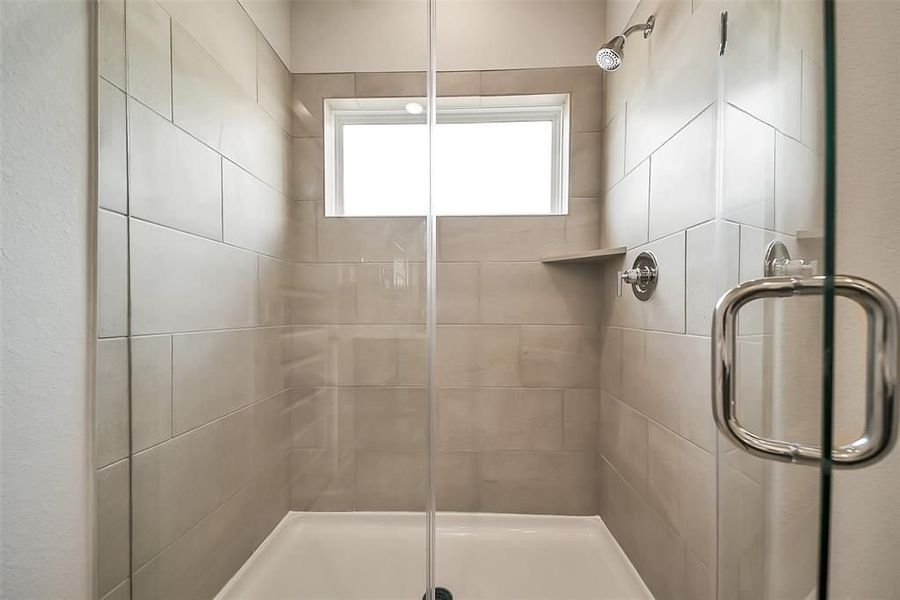 Furnished interior view inside a new home in Sunterra, Katy (Image 39).