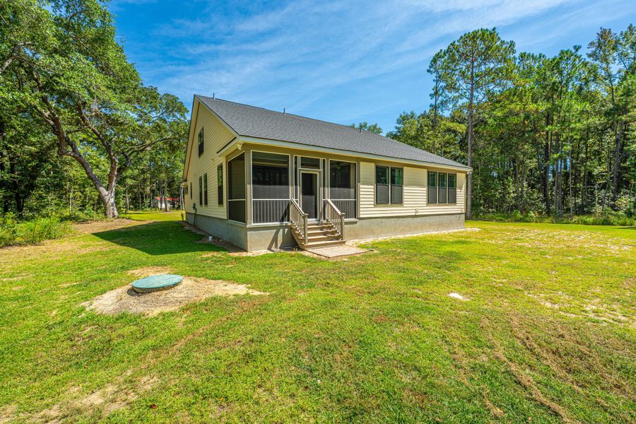 Exterior details and patio area of a home in , Awendaw (Image 19).