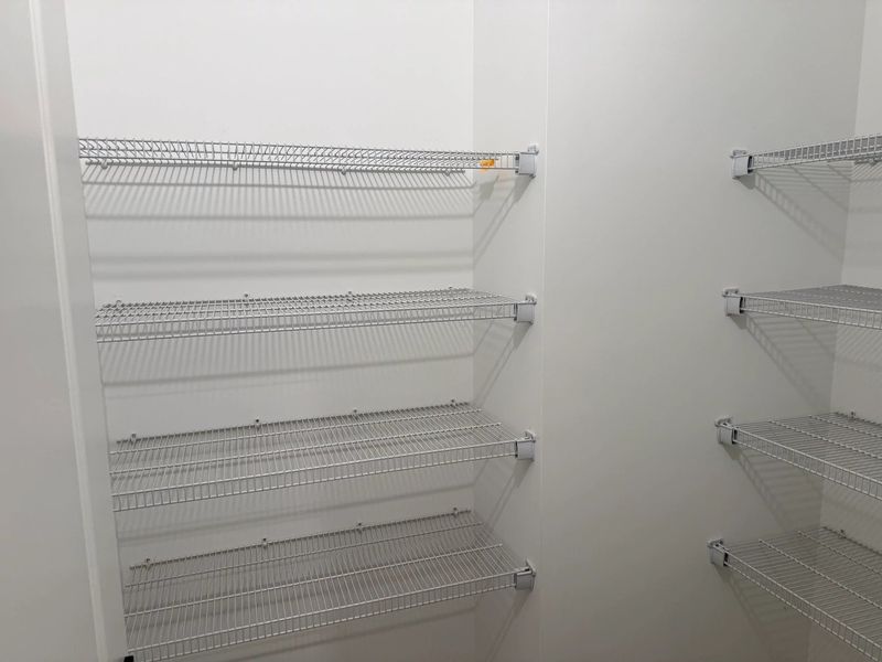 Pantry featuring the AW Collection® Serene - Sleek storage framed by clean design. Pantry featuring the AW Collection® Serene - Sleek storage framed by clean design.