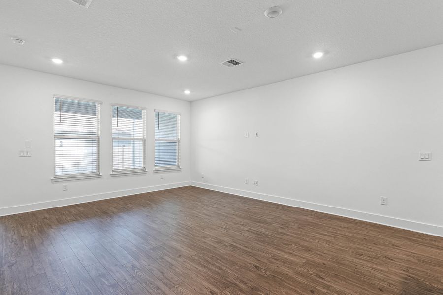 Spacious, unfurnished interior of a new home in Harvest at Ovation - Townhomes, Winter Garden (Image 13).