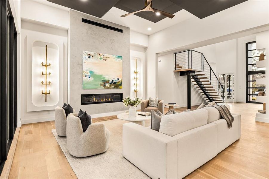 Texture and clean architectural lines give the living room depth and character, while the open flow to the kitchen makes it easy to live in and entertain