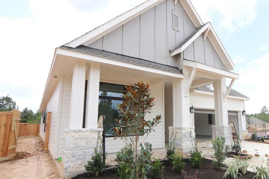 Front exterior of a new home in Kresston, Magnolia, TX, highlighting curb appeal (Image 2).