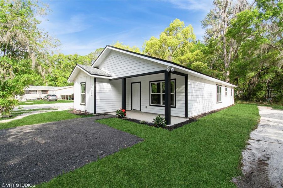 Front exterior of a new home in , Waldo, FL, highlighting curb appeal (Image 2). Front exterior of a new home in , Waldo, FL, highlighting curb appeal (Image 2).
