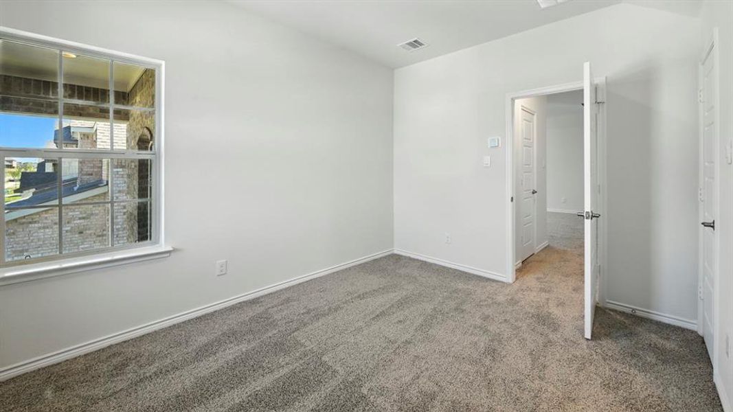 Unfurnished room featuring carpet and baseboards Unfurnished room featuring carpet and baseboards