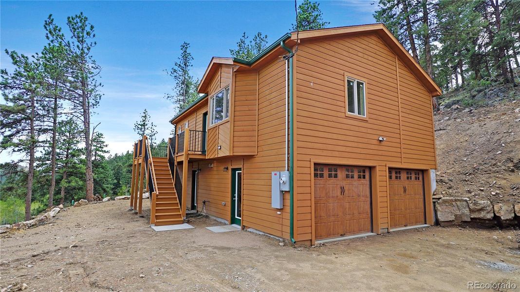 Front exterior of a new home in , Bailey, CO, highlighting curb appeal (Image 16). Front exterior of a new home in , Bailey, CO, highlighting curb appeal (Image 16).