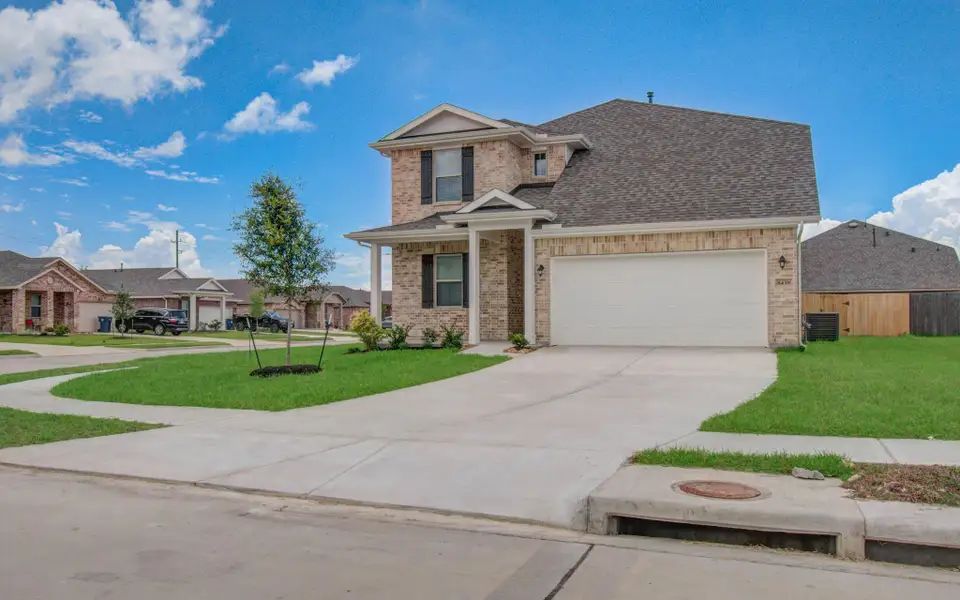 Front exterior of a new home in Legends Bay, Baytown, TX, highlighting curb appeal (Image 22).