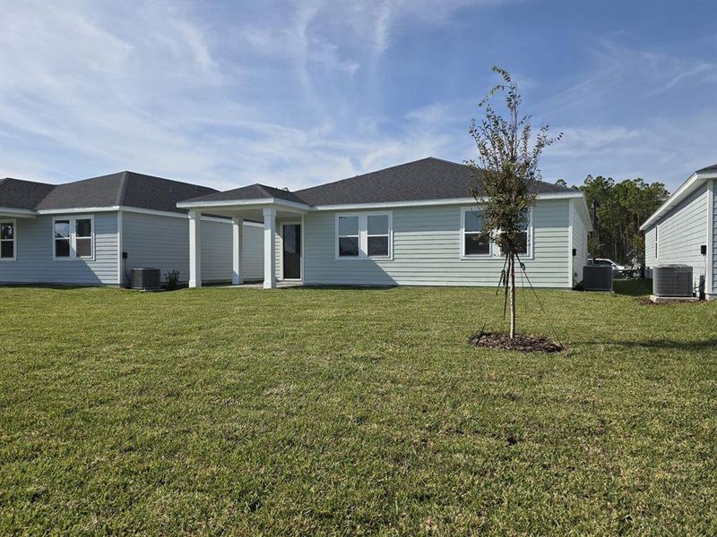 Exterior details and patio area of a home in Colbert Landings, Palm Coast (Image 7).