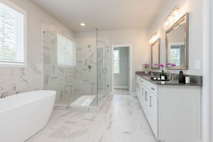 Luxurious master bathroom with dual vanities