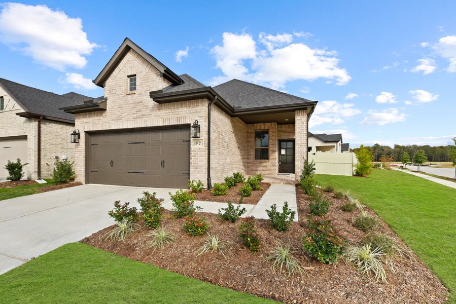 Front exterior of a new home in Wood Leaf Reserve, Tomball, TX, highlighting curb appeal (Image 21).
