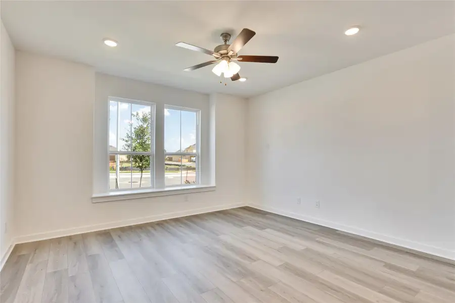 Spare room with light wood-style floors, recessed lighting, and ceiling fan