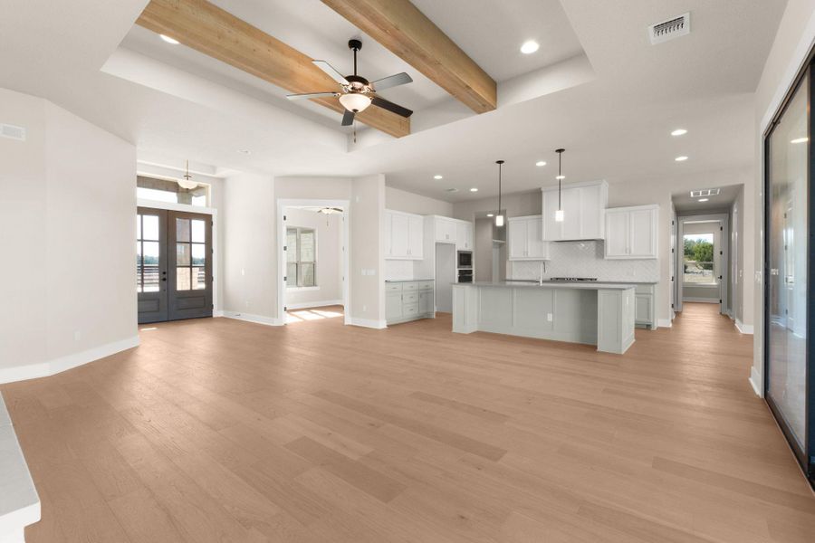 Unfurnished living room with french doors, a ceiling fan, beamed ceiling, recessed lighting, and light wood-type flooring