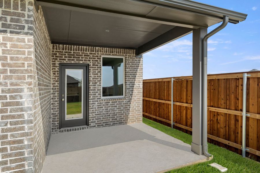 Exterior details and patio area of a home in Creekside, Royse City (Image 2).