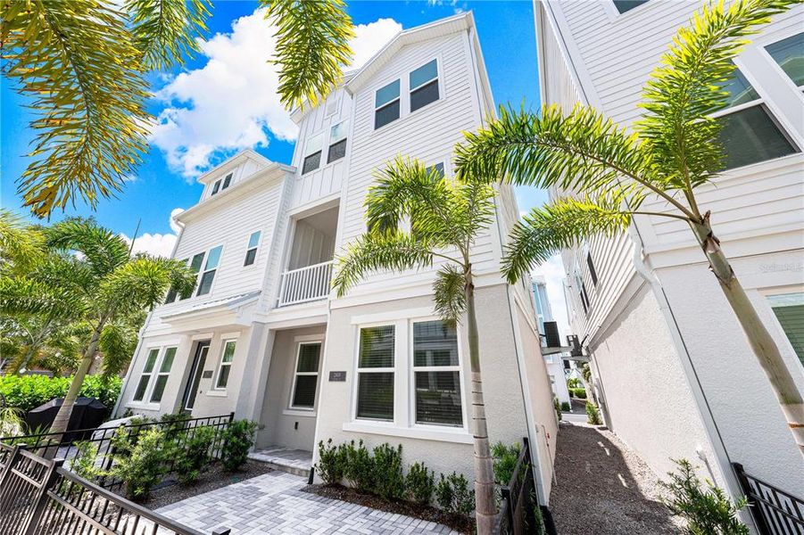 Front exterior of a new home in , Sarasota, FL, highlighting curb appeal (Image 24).