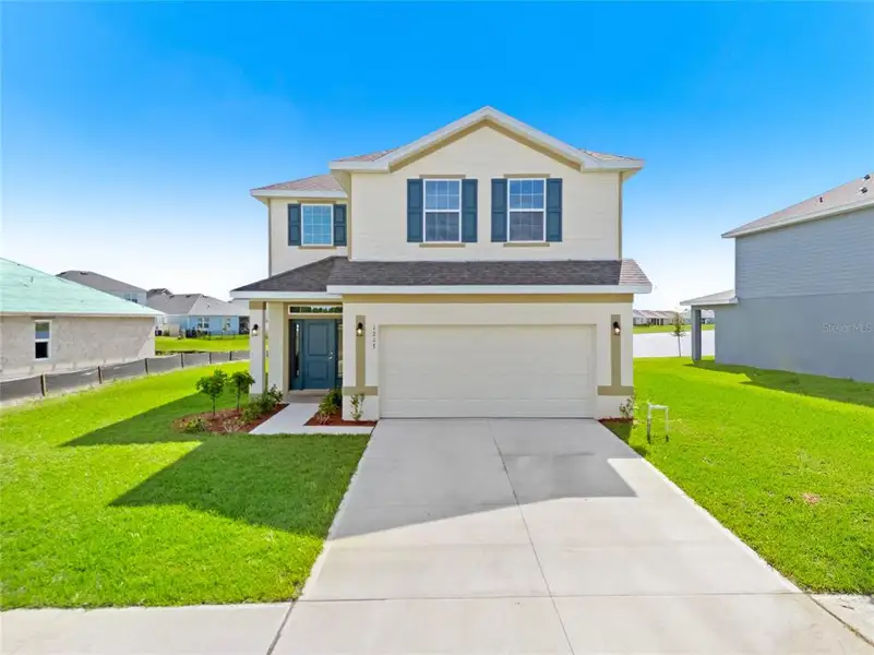 Front exterior of a new home in , Palm Bay, FL, highlighting curb appeal (Image 2). Front exterior of a new home in , Palm Bay, FL, highlighting curb appeal (Image 2).