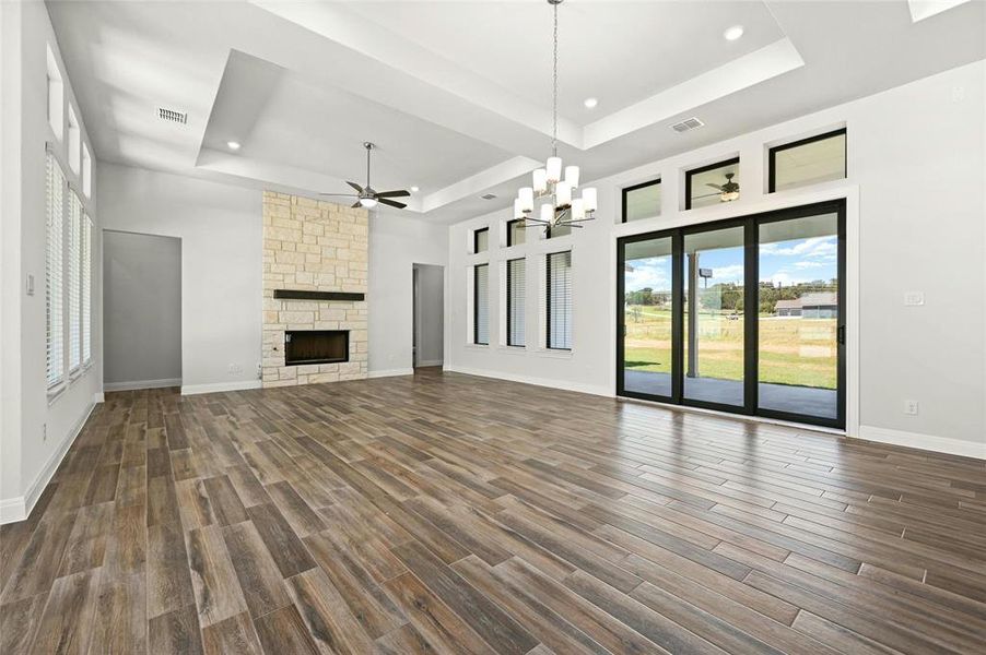 View from the dining room to the family room, Large sliding glass door that opens to the large covered back patio.