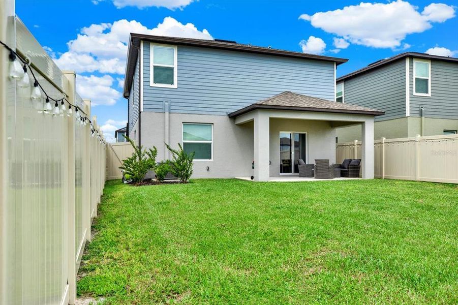 Front exterior of a new home in Two Rivers: The Manors II, Zephyrhills, FL, highlighting curb appeal (Image 28). Front exterior of a new home in Two Rivers: The Manors II, Zephyrhills, FL, highlighting curb appeal (Image 28).